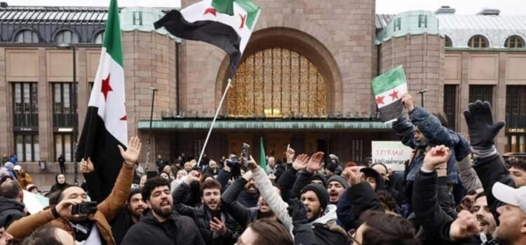 Sirios celebran caída de Al Asad